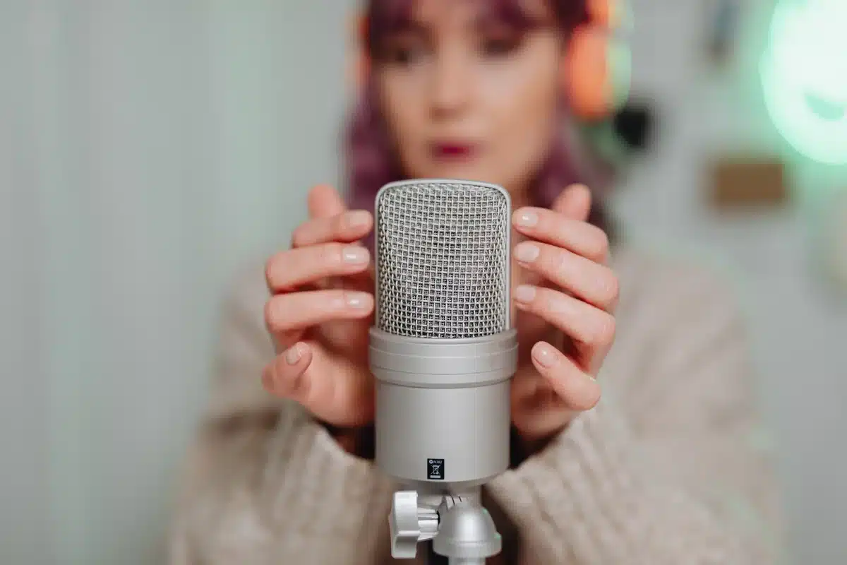 Home recording vocal booth with studio condenser mic and headphones ready for narration