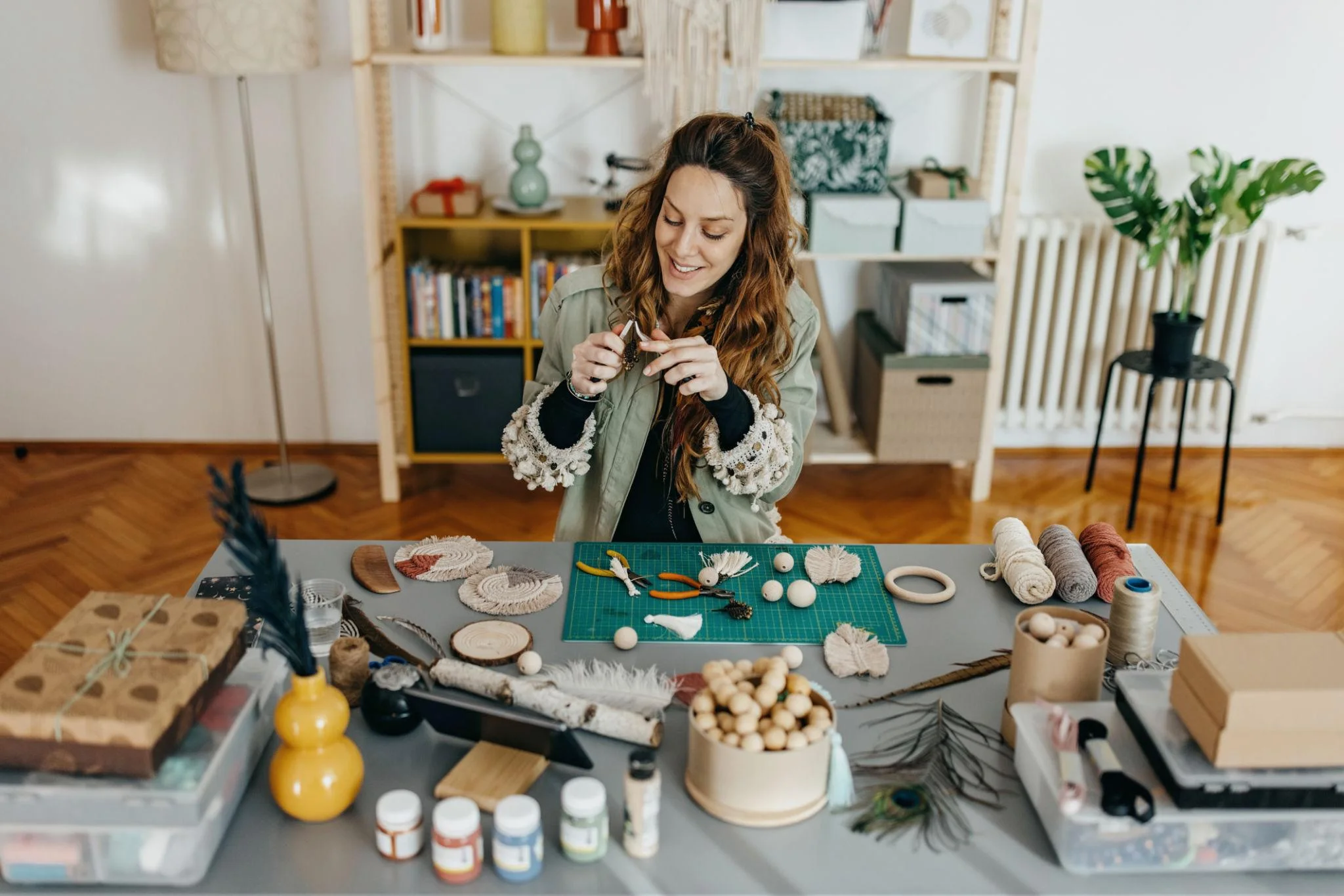 Woman working on personalized handmade keepsakes in a bright, organized home studio